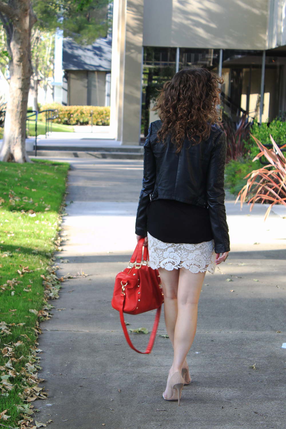 black leather jacket and white lace skirt